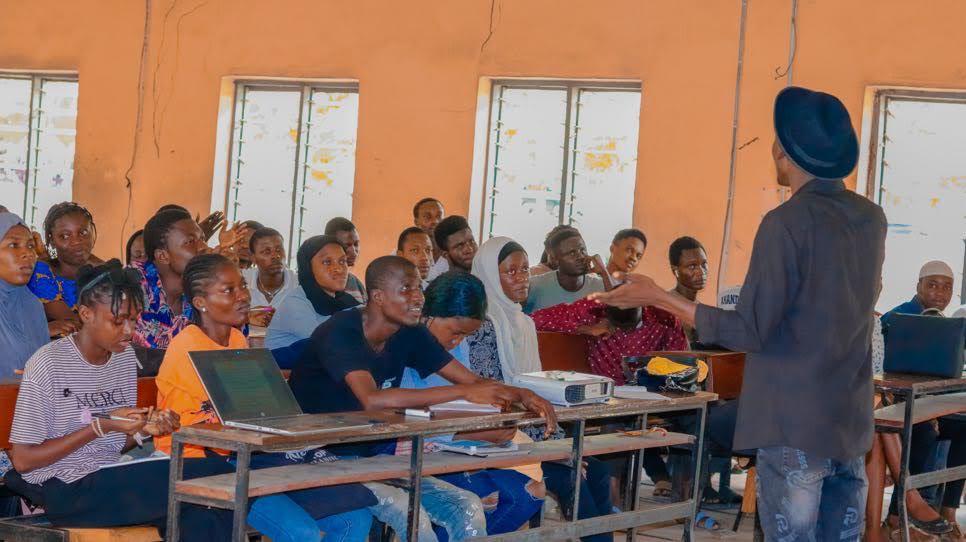 Participants seated in a classroom session